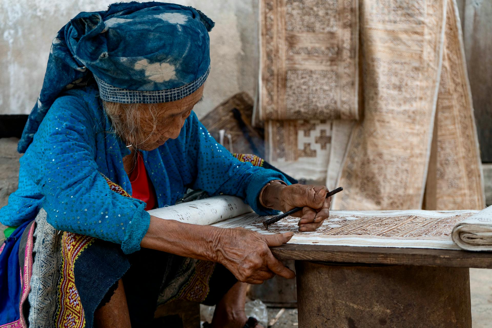 Sapa Ethnic Woman writing at Bac Ha Sunday Market